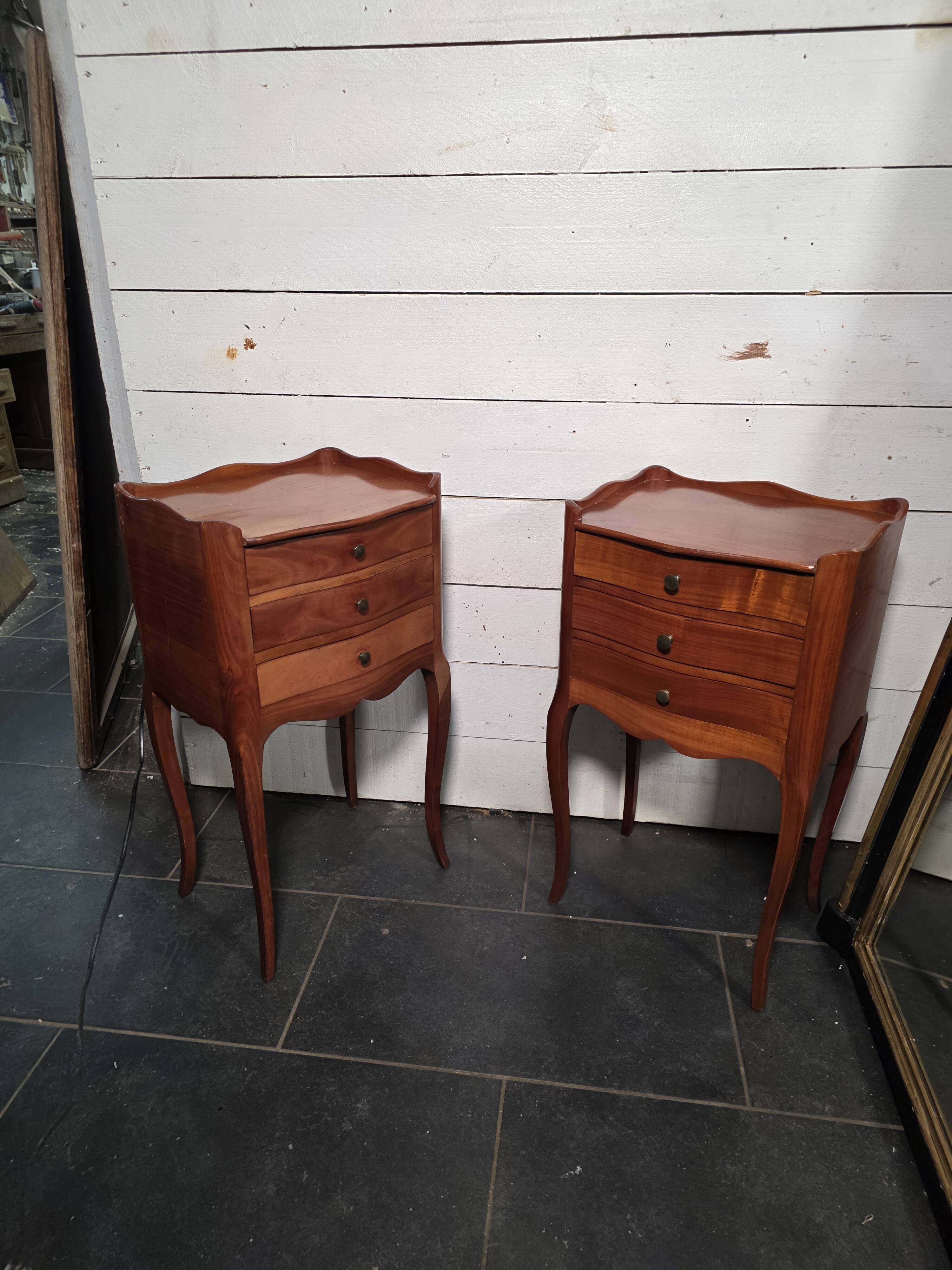 Pair of Louis XV style bedside tables in cherry wood.