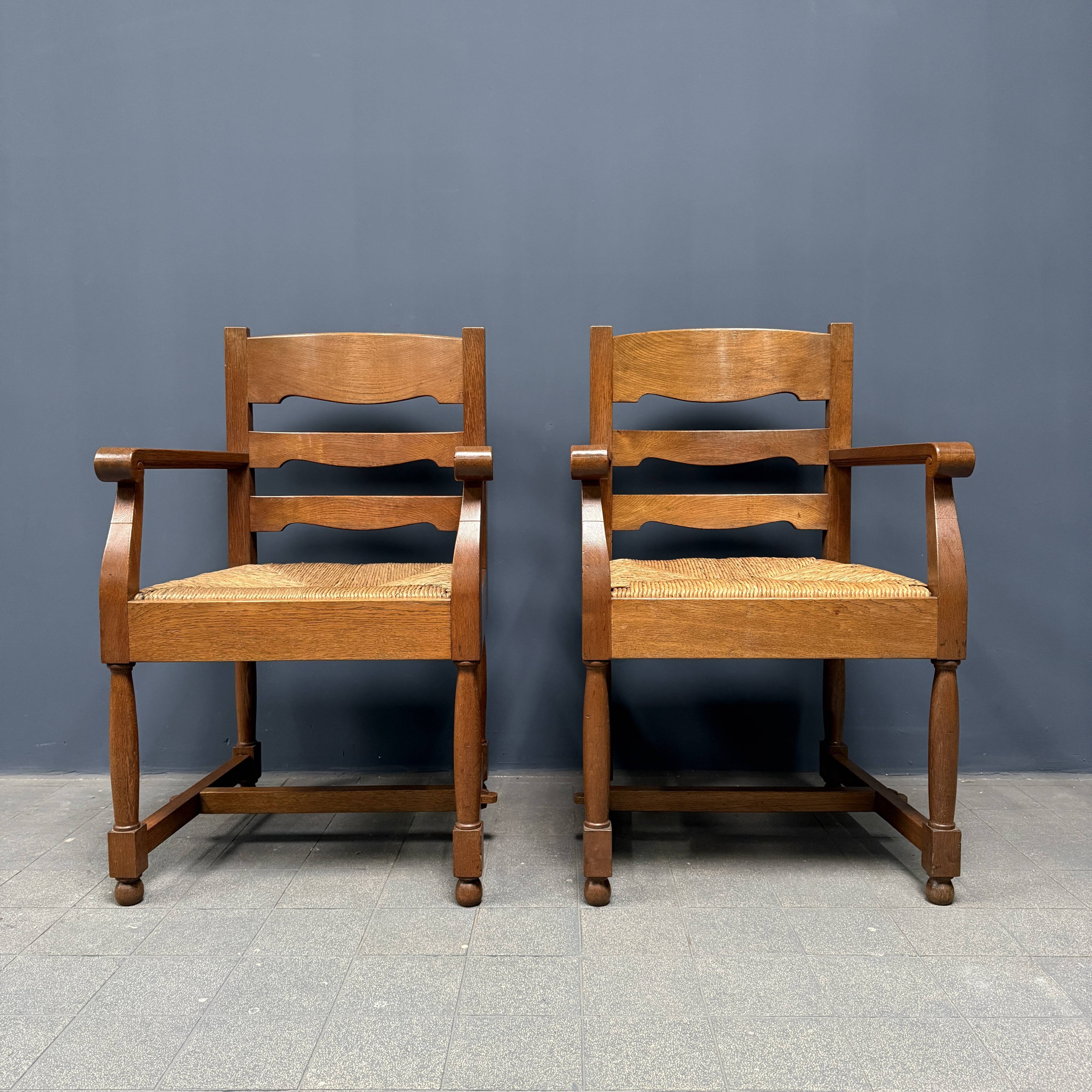 Set of two Dutch oak armchairs with rush seats