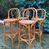 Set of four cane and webbing bar stools