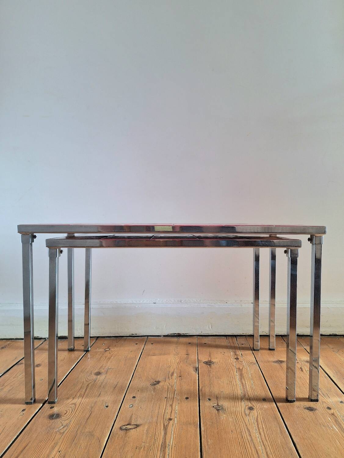 Pair of nesting coffee tables, vintage ceramic furniture.