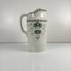 Antique earthenware pitcher, green floral decoration, fine ironstone from the late 19th to early 20th century.