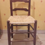 2 wooden and straw chairs