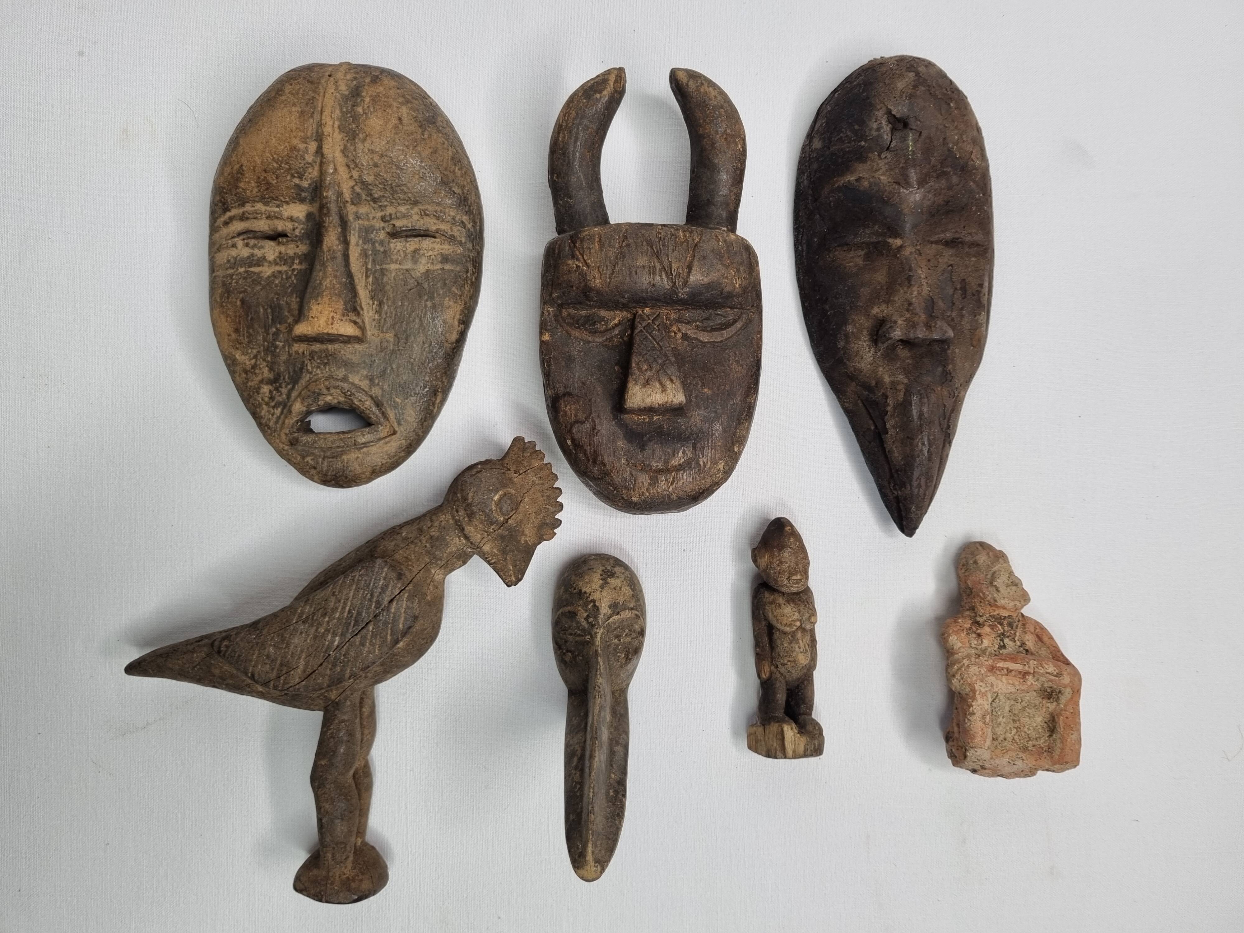 Collection of passport masks and sculptures in wood and terracotta, 7 pieces, 5 to 18 cm