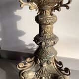 Large bronze candlestick with tripod and winged dog decoration, 19th century.