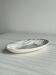 Tidy, small black and white designer dish Salins France.
