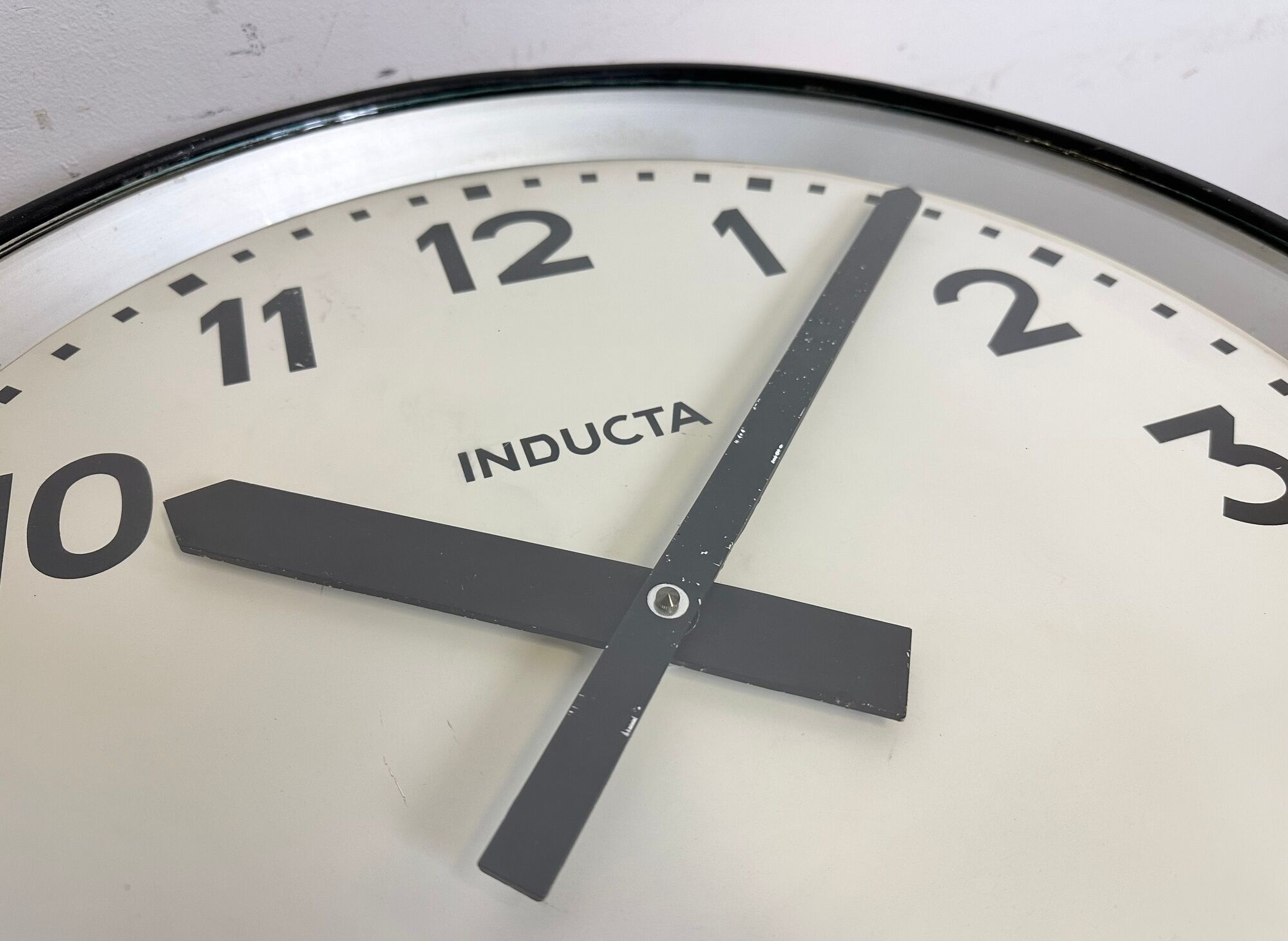 Black swiss industrial wall clock from inducta, 1960s