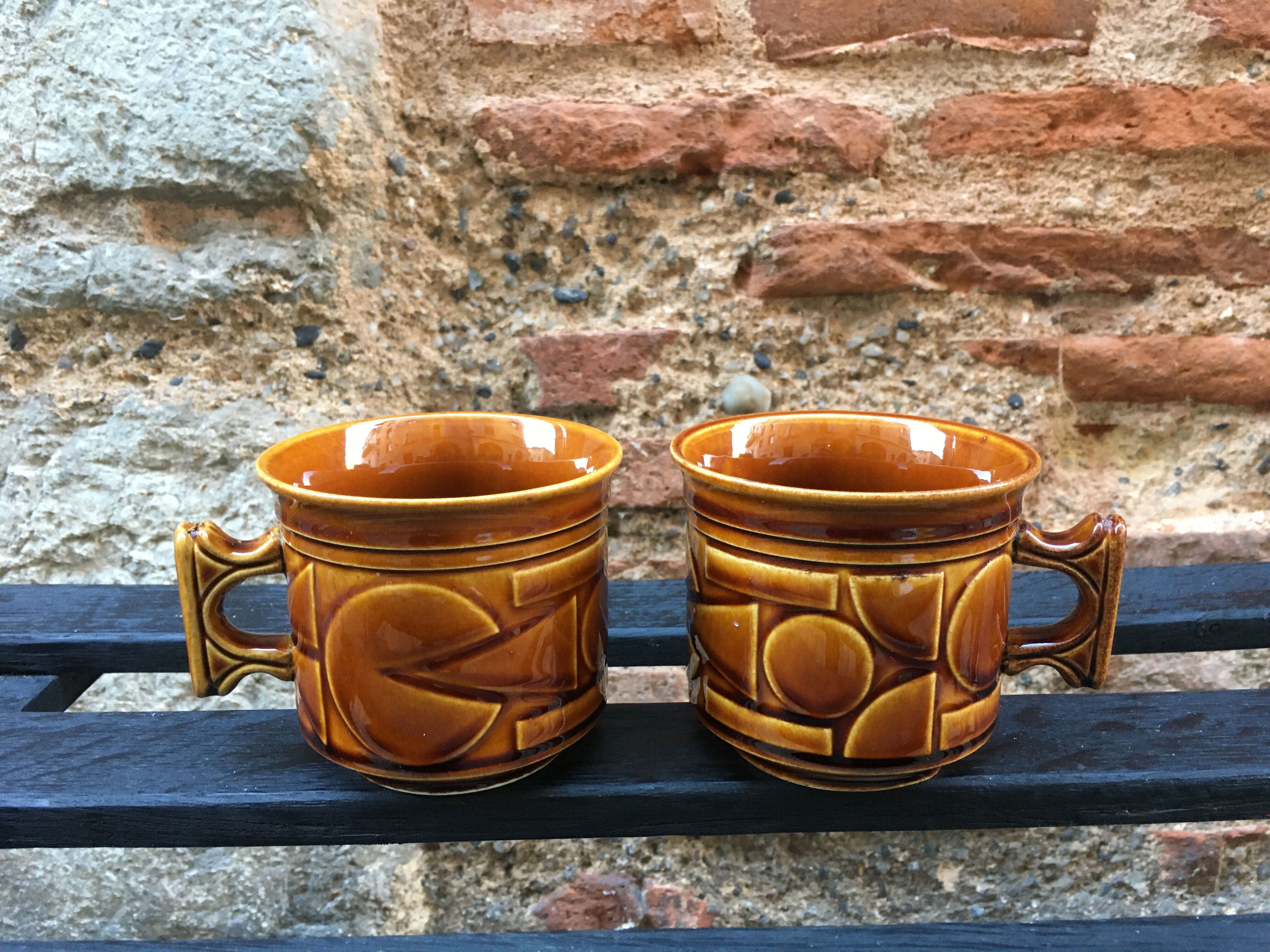 Two brown coffee cups