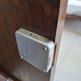 Small storage unit in solid wood and copper.