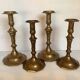 Four brass candle holders