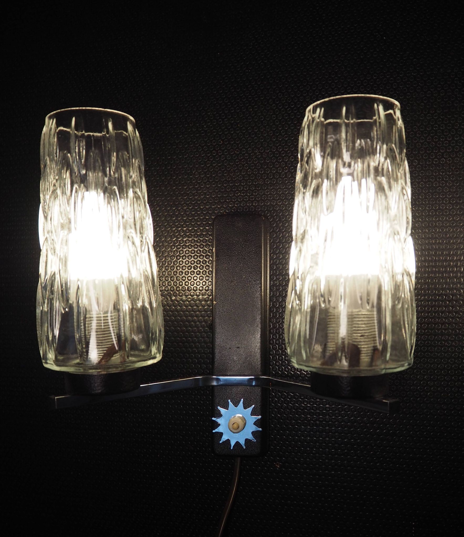 Pair of wall lights from the 1950s-1960s with a push button switch.