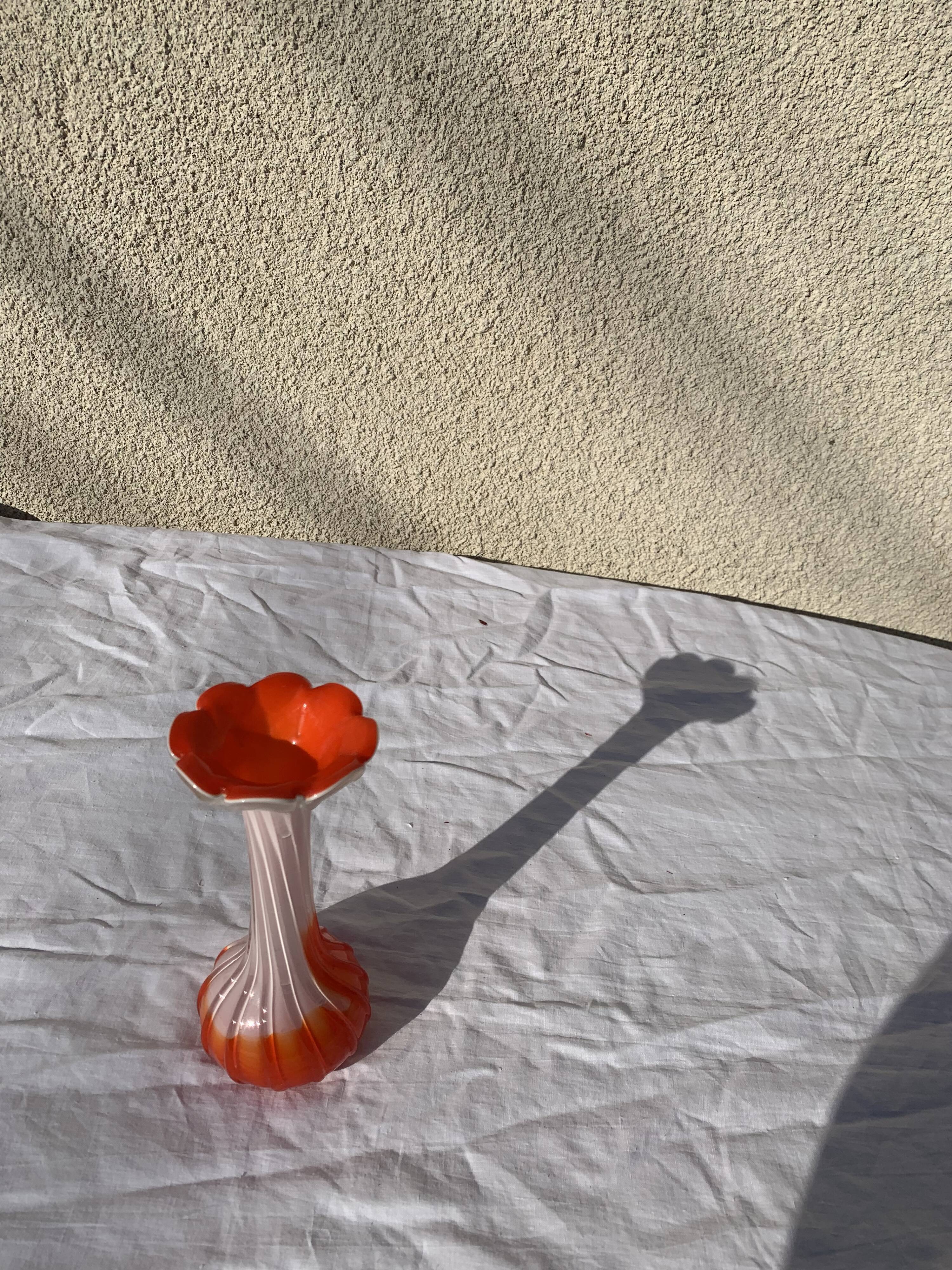Orange and white opaline vase in the shape of a vintage flower corolla