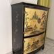 Curved bar cabinet inspired by Chinese design, black lacquer and red interior.