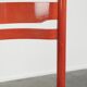 Red vintage wooden chair from the 1970s with a woven wicker seat