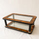 Table basse en loupe de bois, verre et laiton de style Art Déco
