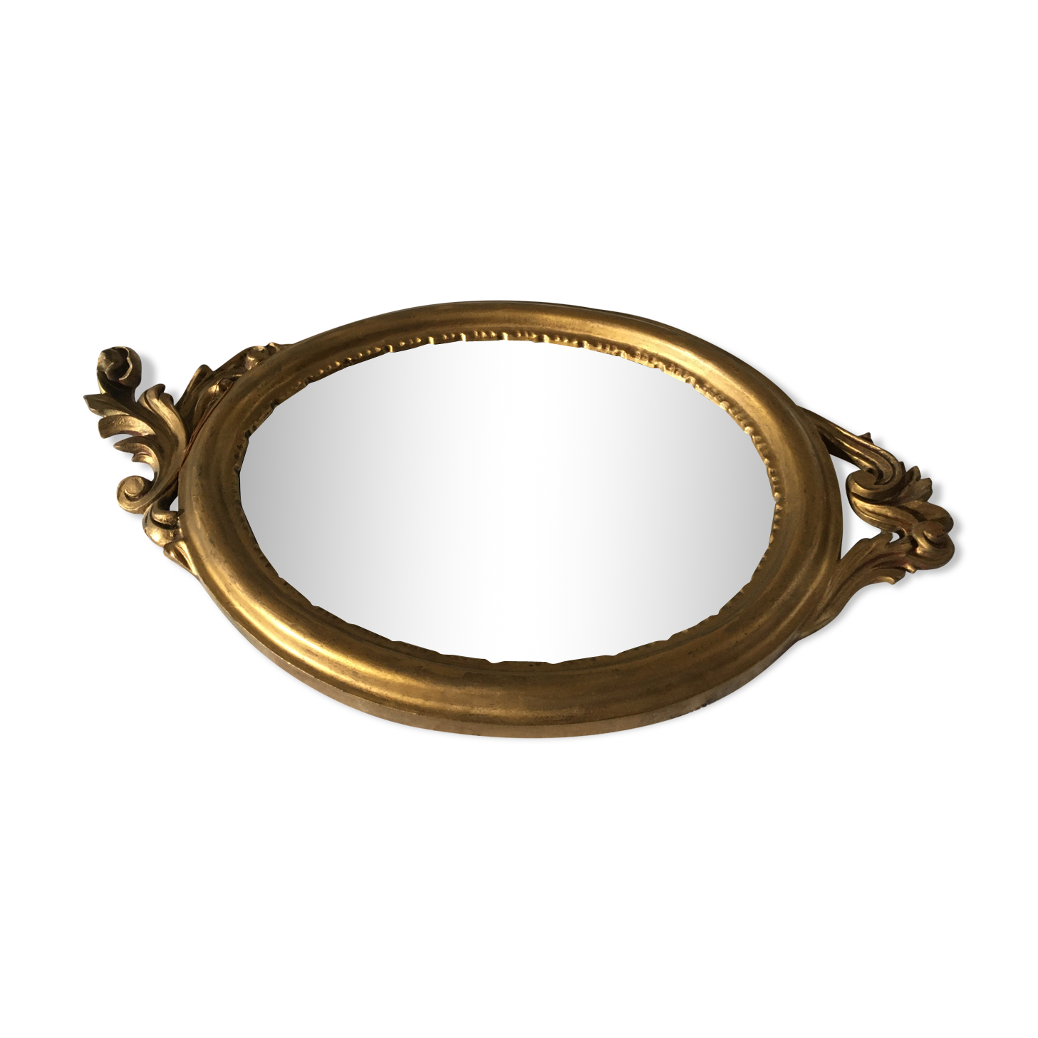 Golden oval mirror