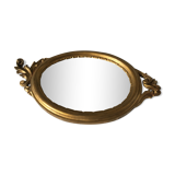 Golden oval mirror