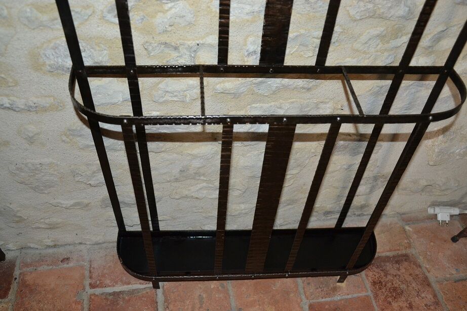 Wrought iron wardrobe with oval mirror