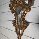 Italian mirror in gilded wood with gold leaf from the 18th century.