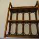 Varnished rattan wall shelf