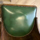 Pair of green leather gondola chairs Art Deco by De Coen