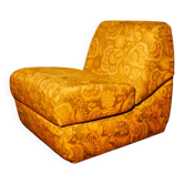 Floral fabric convertible armchair, circa 1970.