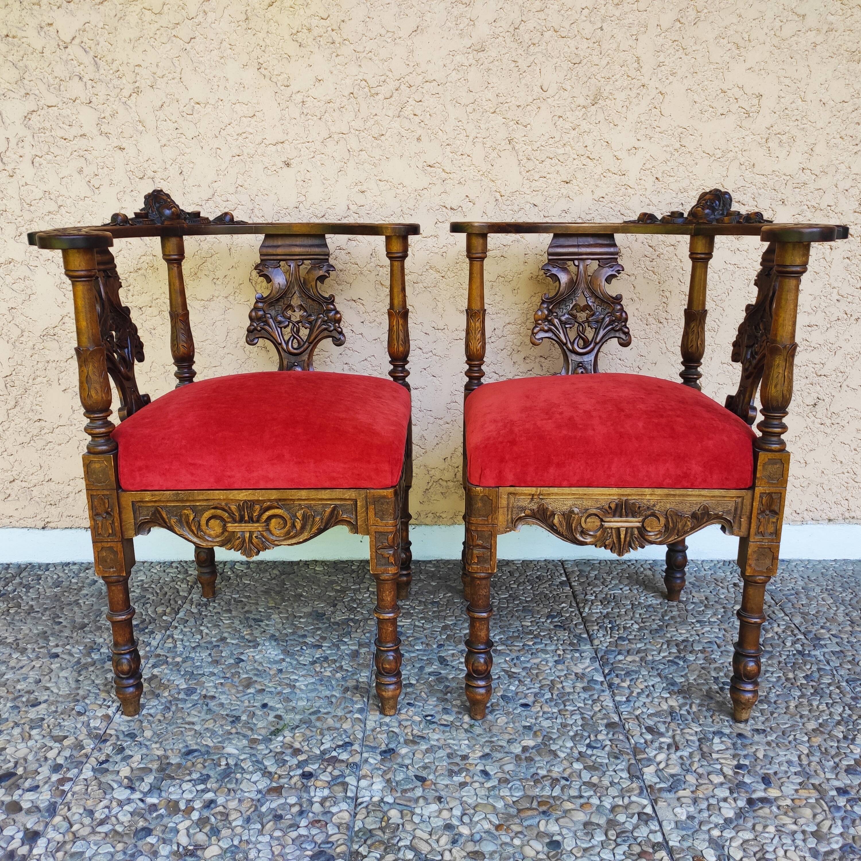 Pair of neo-Renaissance Henri II corner armchairs in carved wood, 19th century.