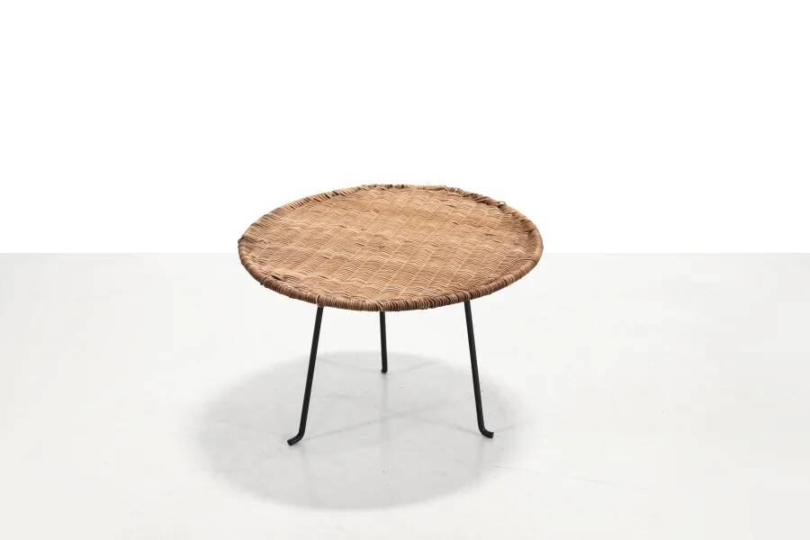 Round rattan side table by Raoul Guys