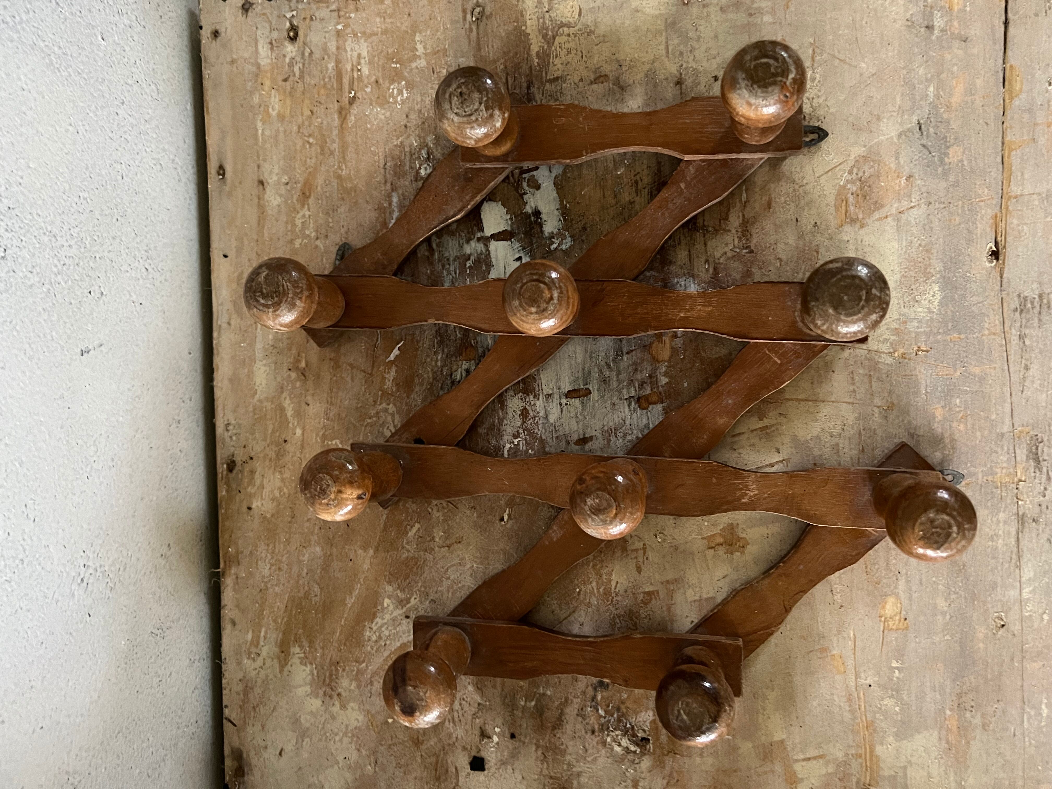 Wooden accordion wall coat rack