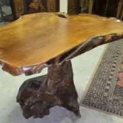 Sculpted olive wood table, made from a root.
