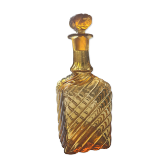 Antique decanter made of amber blown glass