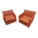 Pair of orange leather club chairs 1980