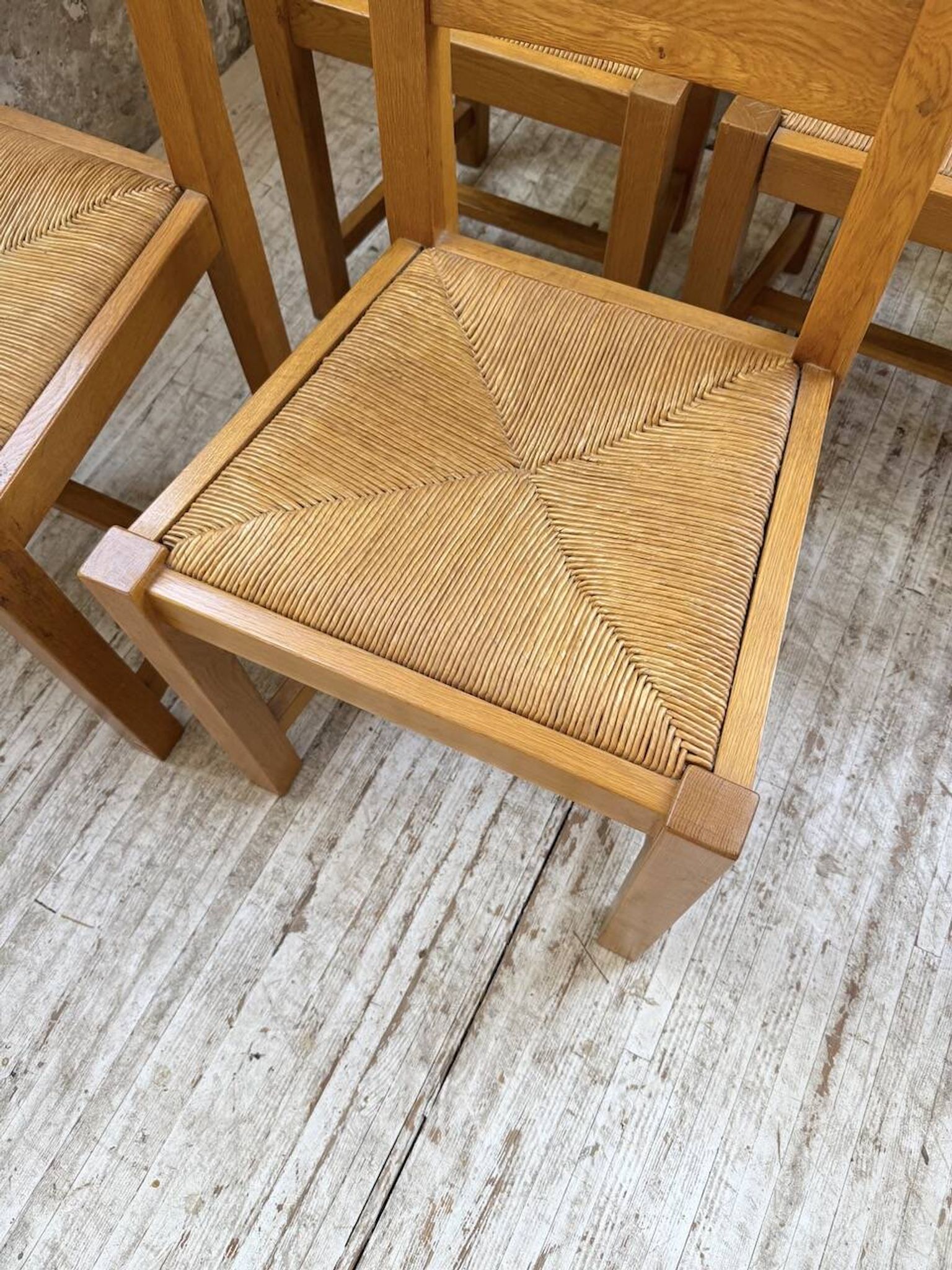 Set of 8 blond oak chairs with straw seats