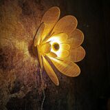 Flower wall light made of rattan and raffia petals