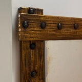 Brutalist mirror with a hammered copper and brass frame.