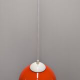 Pair of spherical pendant lights in orange opaline, France circa 1970.