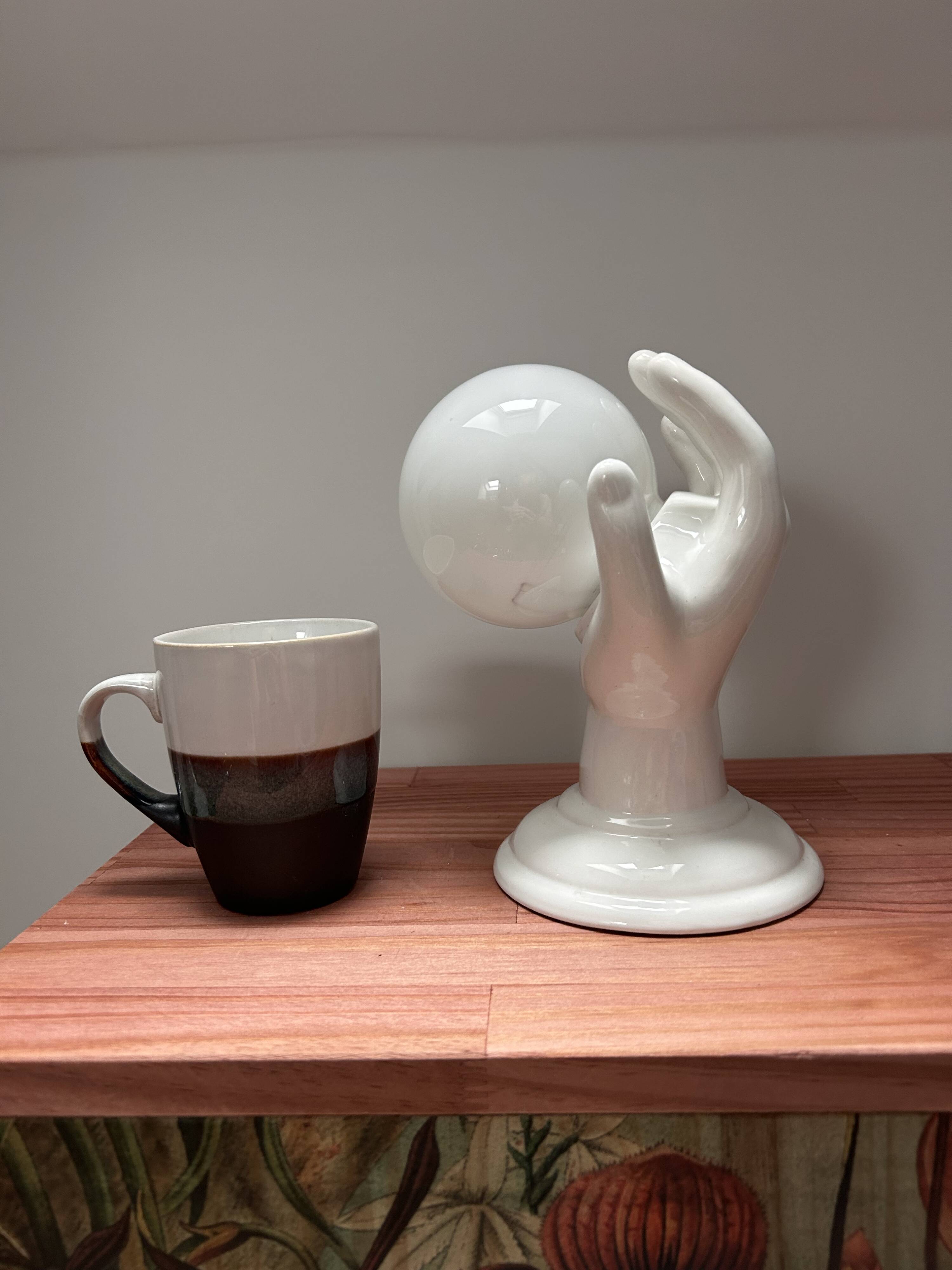 Ceramic hand wall light