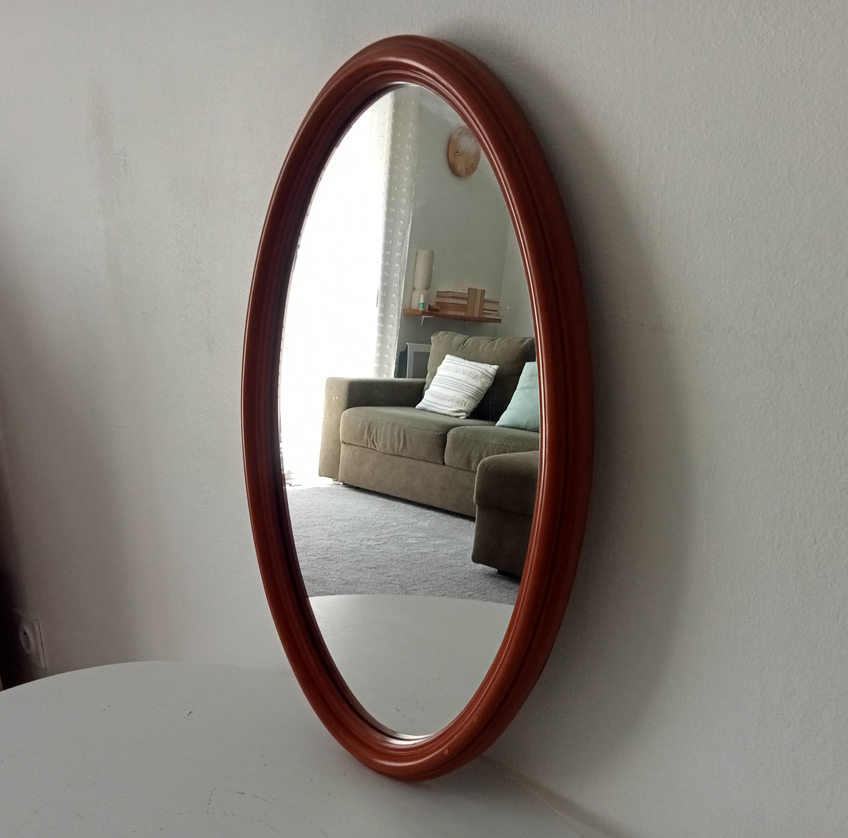 Vintage oval wooden mirror "caramel" from the 1960s.