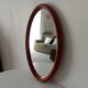 Vintage oval wooden mirror "caramel" from the 1960s.