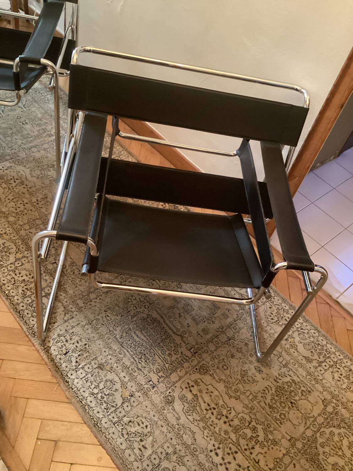 Pair of Wassily black leather armchairs