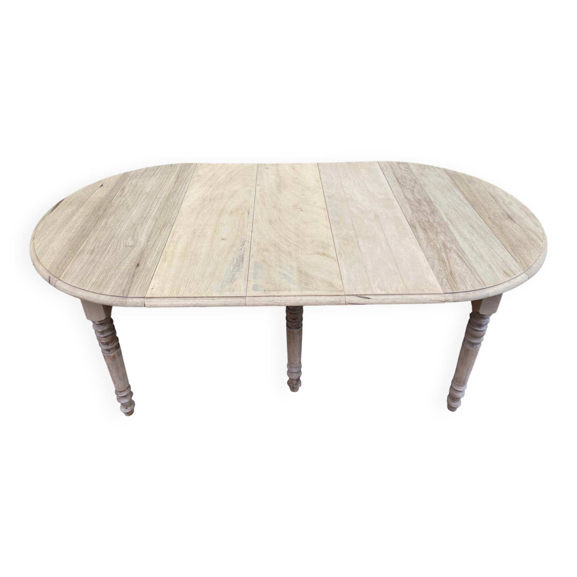 Round extendable dining table with flaps, stripped in raw oak, with 3 extensions.