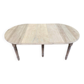 Round extendable dining table with flaps, stripped in raw oak, with 3 extensions.