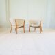 Mid-century lounge chairs in sheepskin/shearling and stained wood, Sweden, 1962.