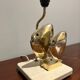 Brass lamp in the shape of a fish by Somchai Hattakitkosol.