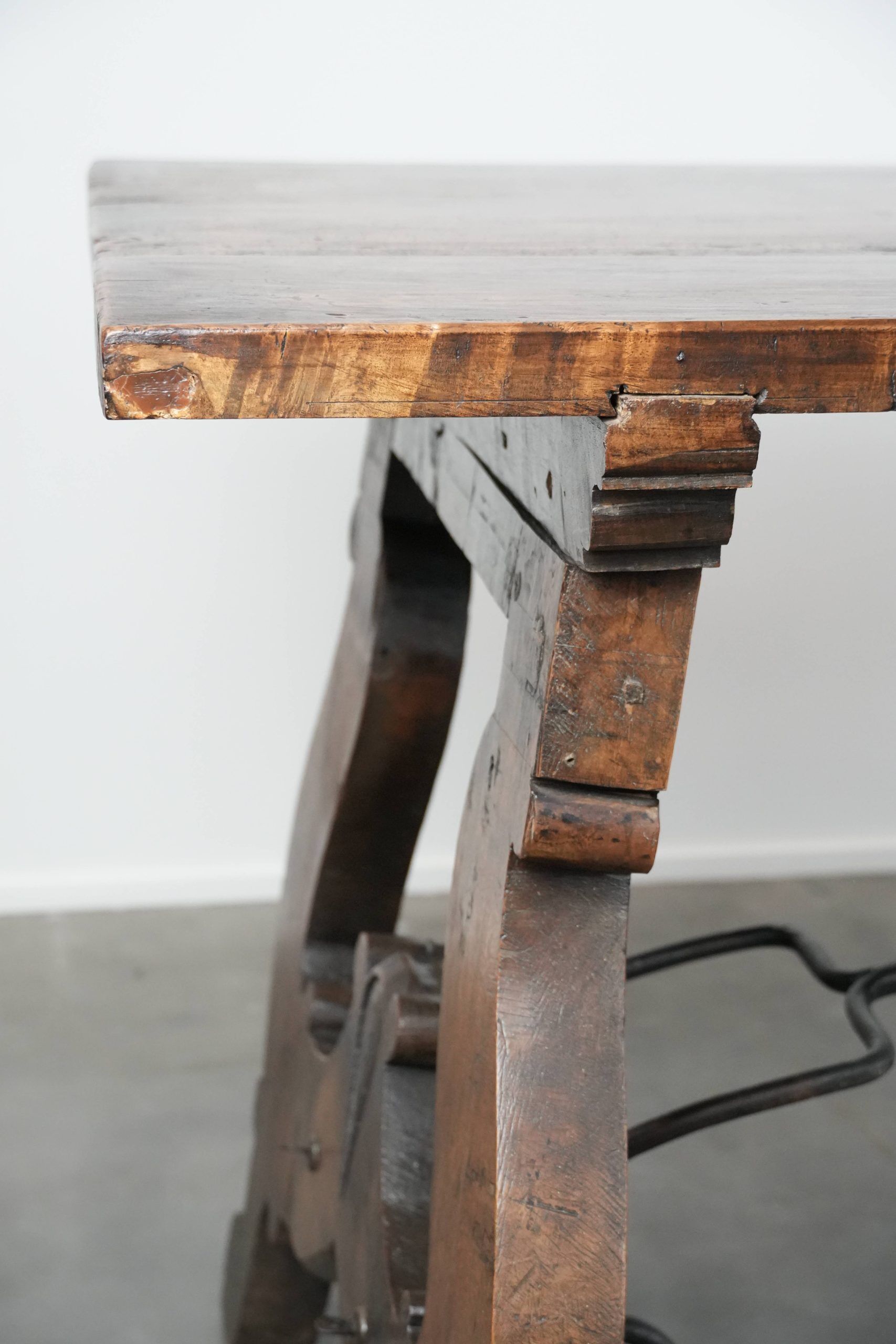 Antique 18th-century Spanish dining table with a wrought iron base
