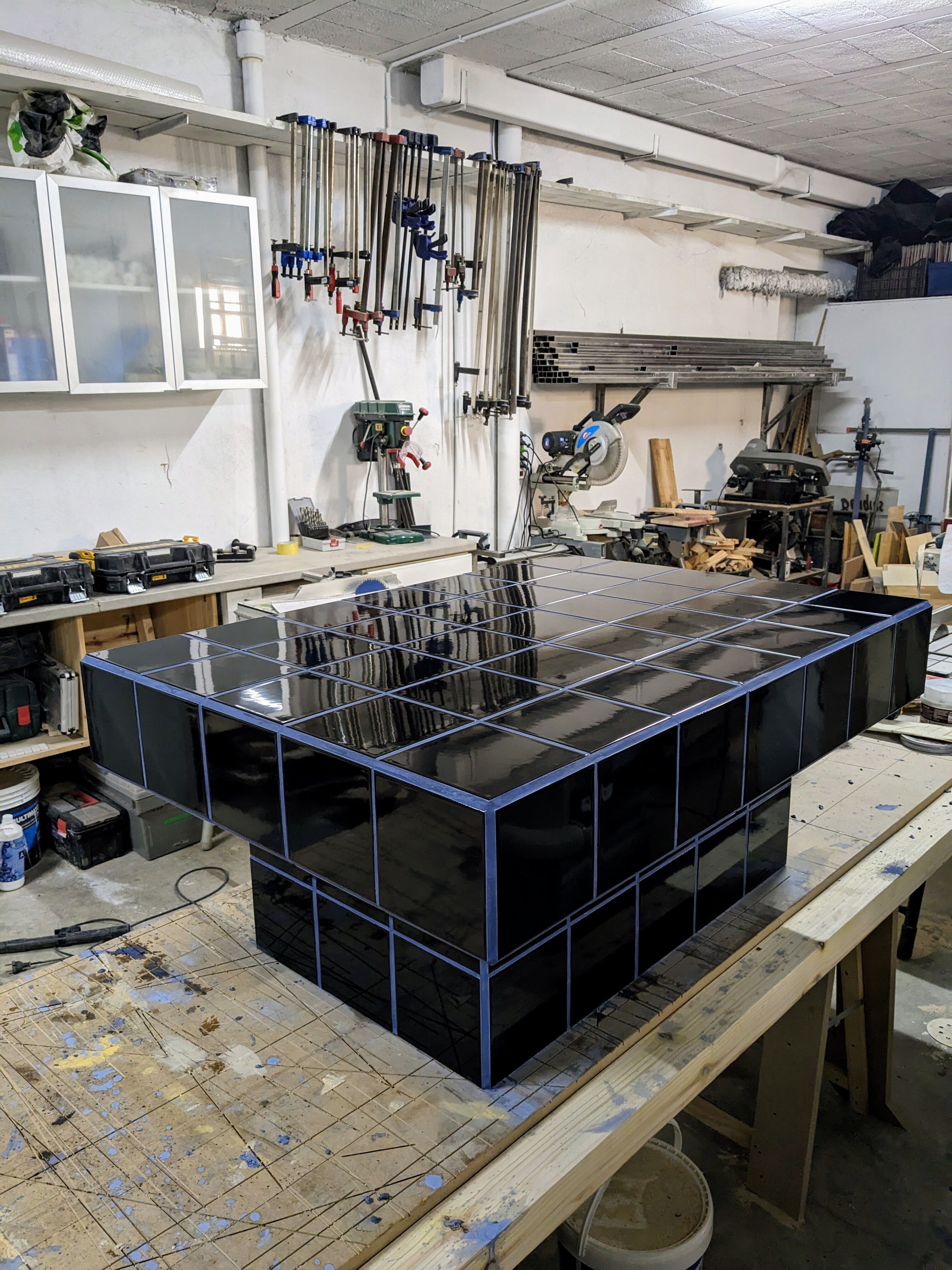 Black tiled coffee table and midnight blue grout