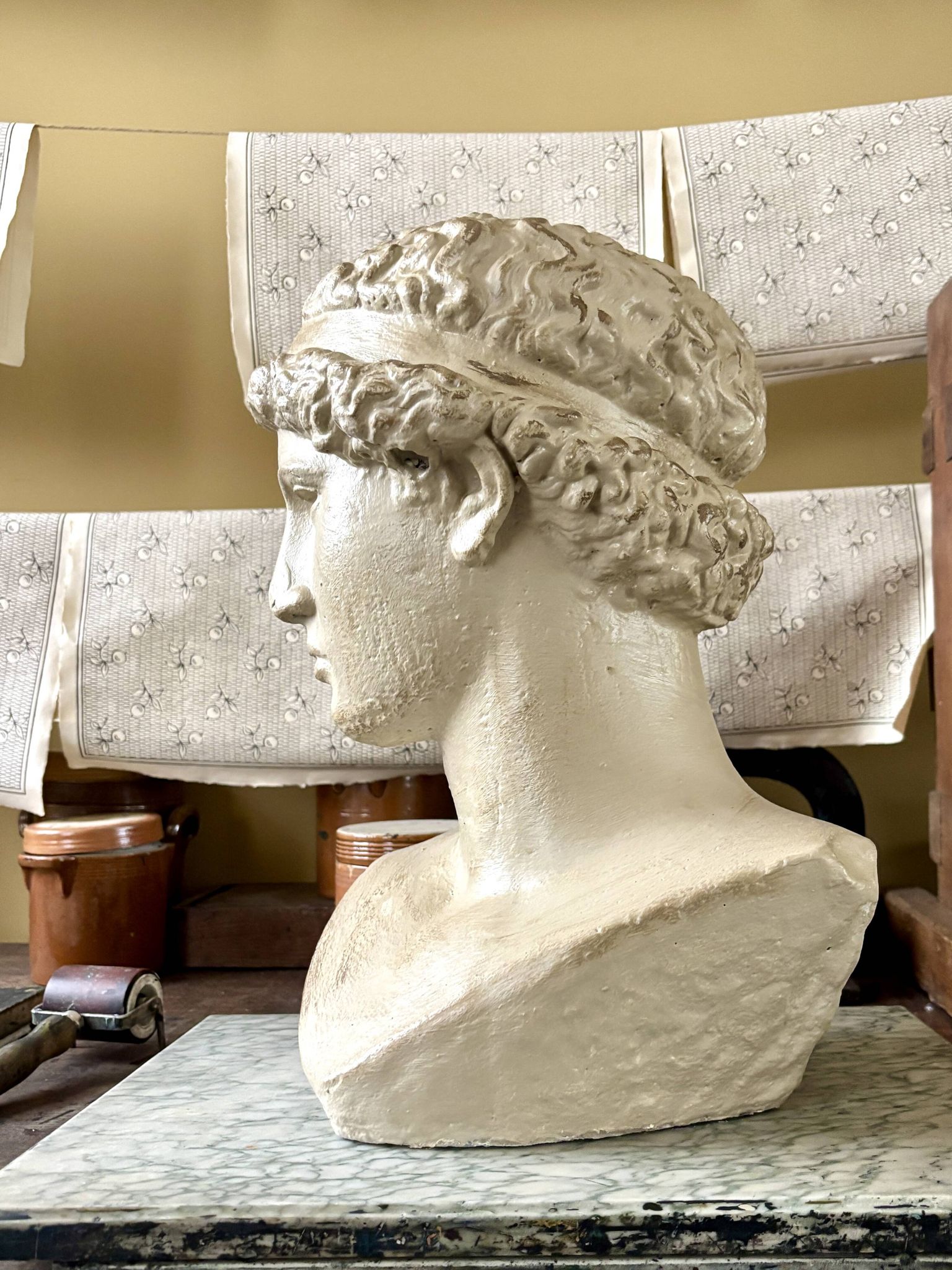 Concrete bust painted in beige - reproduction, detail of "The Dying Slave"