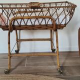 Vintage wicker and rattan couffin on wheels