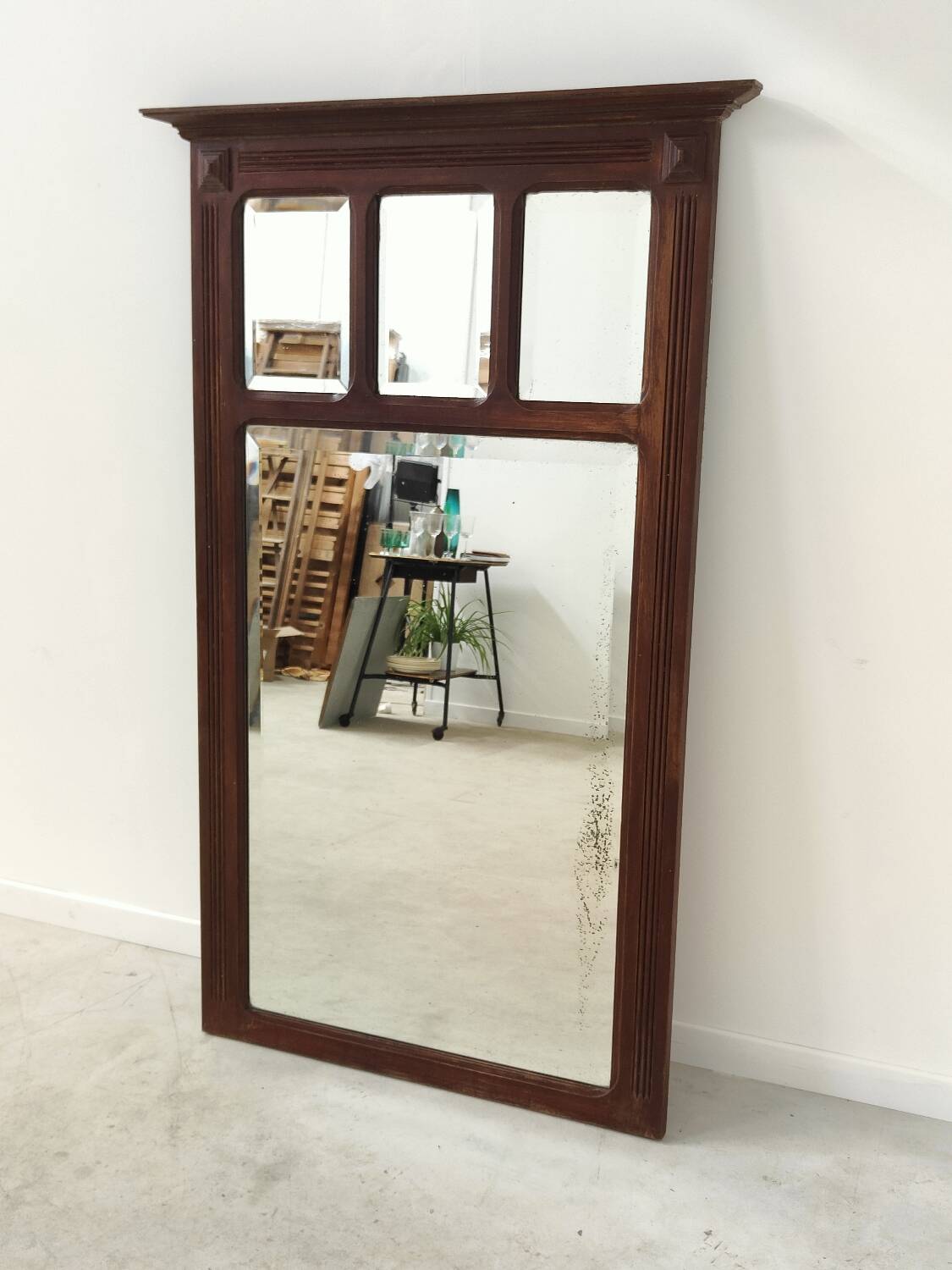 Antique beveled mirror on a wooden frame, 1930