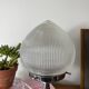 Antique lamp with a glass globe in Holophane style and chrome metal.
