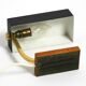 Beautiful small Mid Century Modern metal and brass table lamp with teak bas